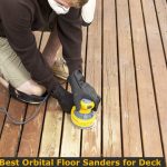 Sanding wood deck boards with palm orbital sander.
