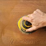 Use Dewalt small palm sander to sand hardwood floor.