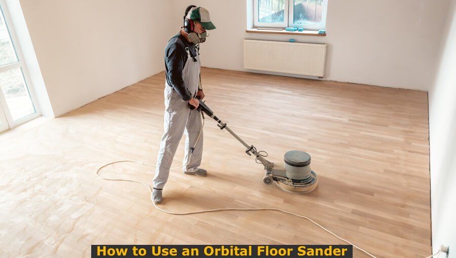 Worker operating floor orbital sander to to hardwood flooring.